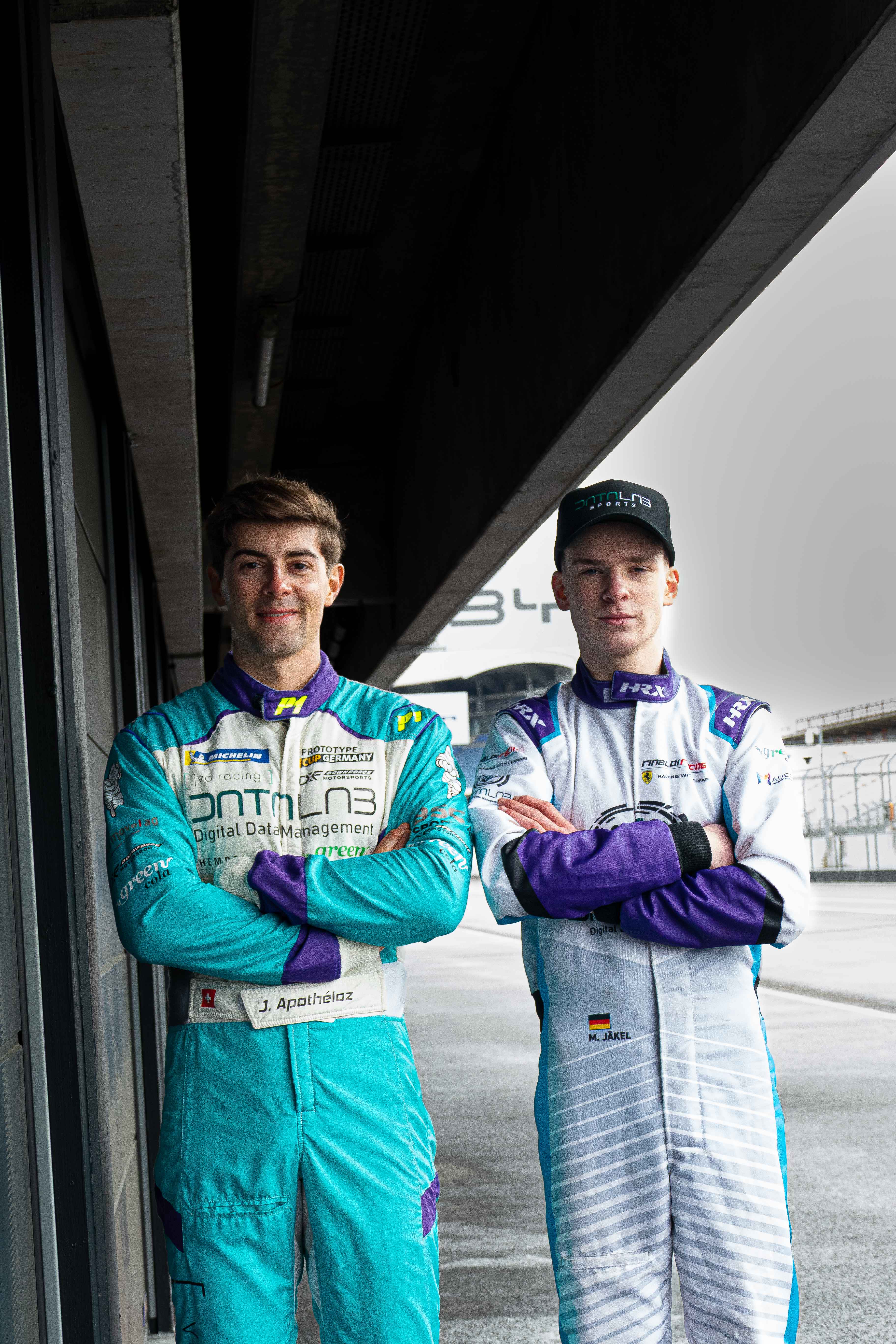 Malte Jaekel with a fellow driver in the pit lane