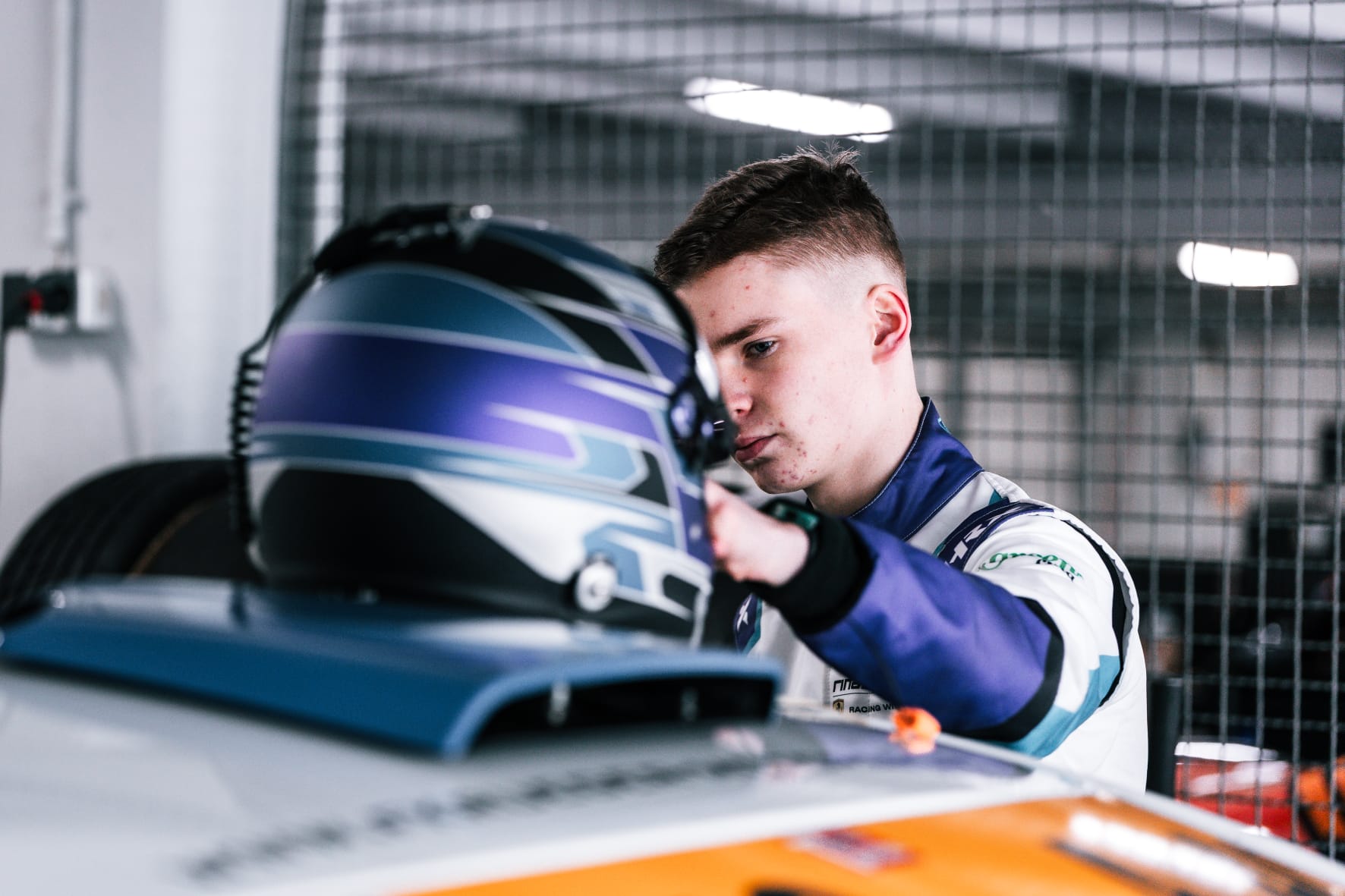 Malte Jaekel preparing with his helmet in the garage