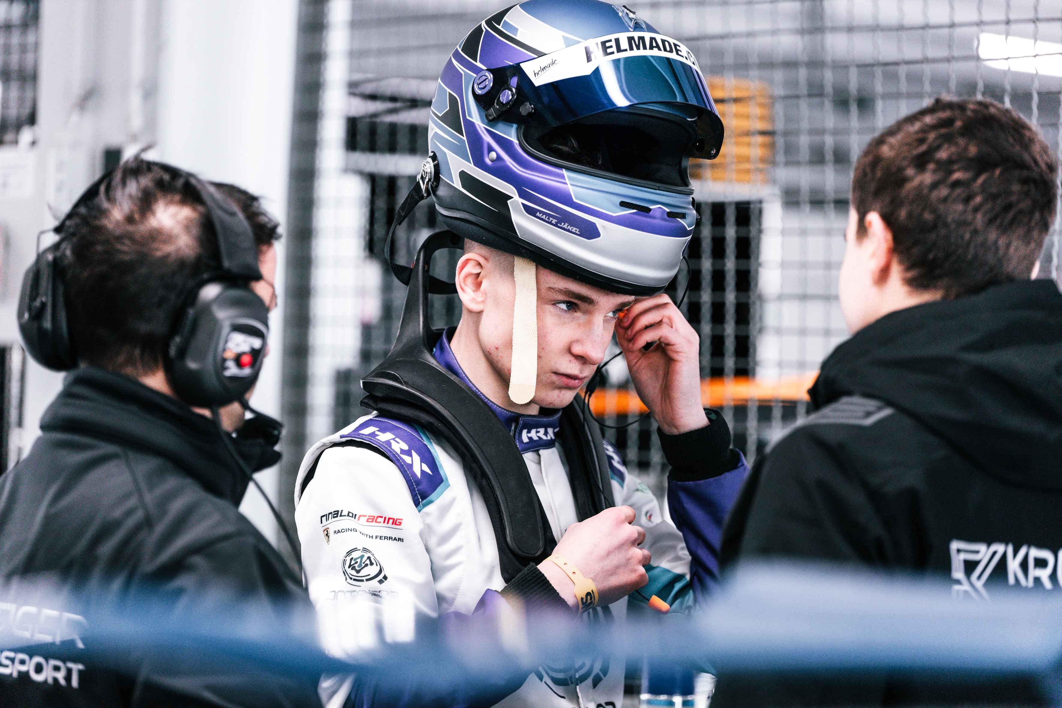 Malte Jaekel with his helmet in the paddock at Hockenheimring